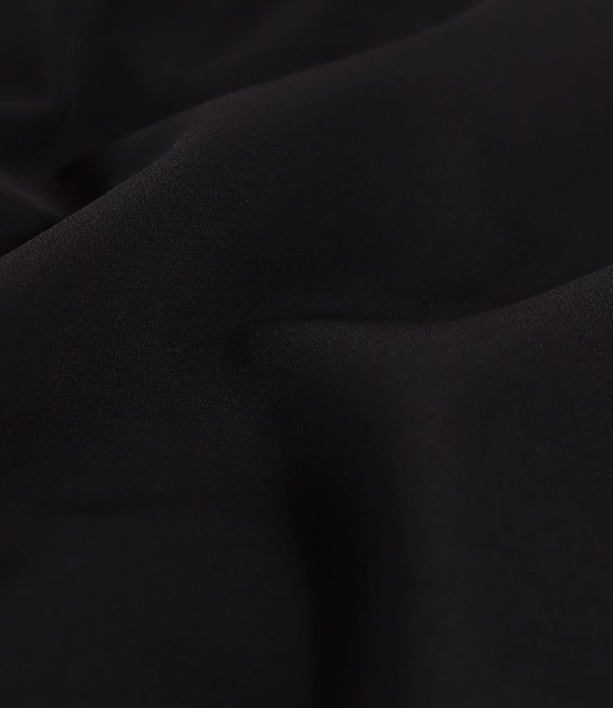 Pantaloni evazati din stofa elastica