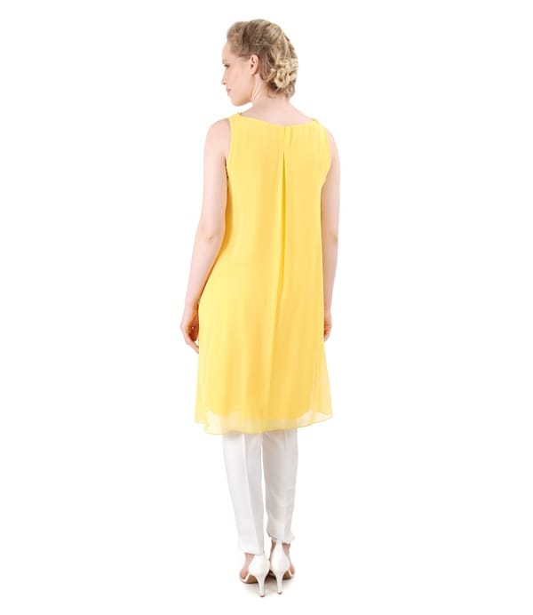 Tinuta eleganta cu rochie din voal si pantaloni pana